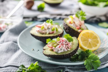 Bio organic avocado filled with homemade mayo, crab meat and herbs